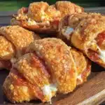 football-shaped pepperoni cream cheese crescent bites - featured image