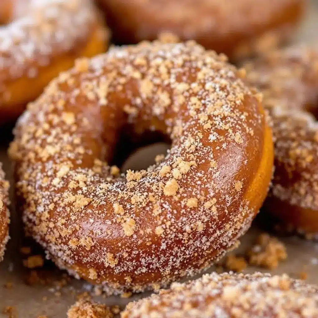 baked pumpkin donuts with cinnamon sugar coating - featured image